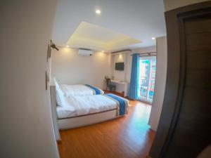 Letto o letti in una camera di Hotel Mega & Apartment