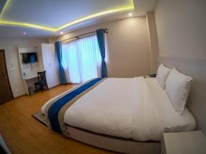 Letto o letti in una camera di Hotel Mega & Apartment