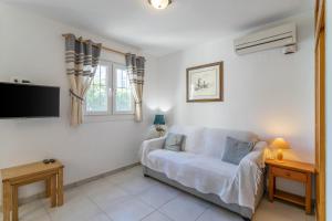 TV a/nebo společenská místnost v ubytování Heads 2 Holiday Homes Townhouse