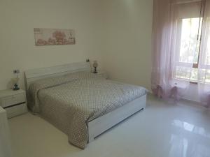 Ένα ή περισσότερα κρεβάτια σε δωμάτιο στο Anna's house Su Planu