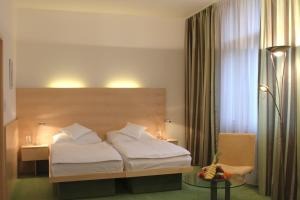 Posteľ alebo postele v izbe v ubytovaní Hotel DAP