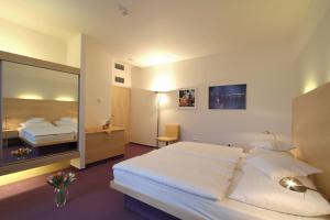 Posteľ alebo postele v izbe v ubytovaní Hotel DAP