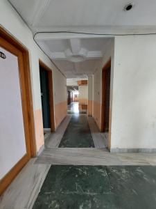 an empty hallway in an old building with a ceiling at HOTEL SHREE VILLA in Harsola