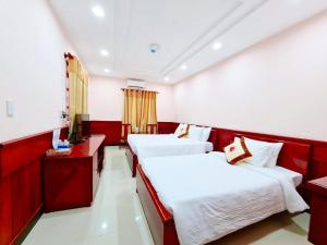 Postel nebo postele na pokoji v ubytování Con Dao Tan Son Nhat Hotel