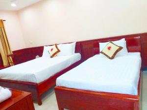 Postel nebo postele na pokoji v ubytování Con Dao Tan Son Nhat Hotel