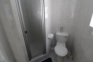a small bathroom with a shower and a toilet at Mont Blanc 17 in Margate +12 photos