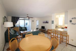 a living room with a table and chairs at Mont Blanc 17 in Margate