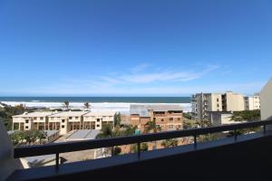 a balcony with a view of the beach and buildings at Mont Blanc 17 in Margate