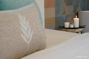 Ένα ή περισσότερα κρεβάτια σε δωμάτιο στο Anise Suites