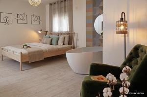 Ένα ή περισσότερα κρεβάτια σε δωμάτιο στο Anise Suites