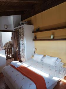 Postel nebo postele na pokoji v ubytování La Casa de los Gatos