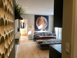 a living room with a couch and a table at Berlin Style Apartments in Berlin