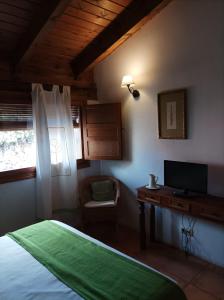 Postel nebo postele na pokoji v ubytování La Casa de los Gatos
