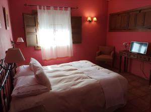 Postel nebo postele na pokoji v ubytování La Casa de los Gatos