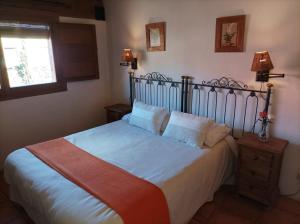 Postel nebo postele na pokoji v ubytování La Casa de los Gatos