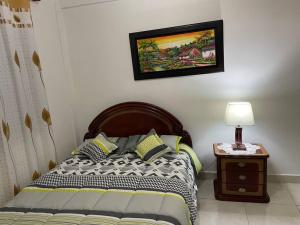 Llit o llits en una habitació de Apartamento amoblado a 10 minutos del centro