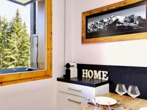 a home office with wine glasses and a window at Charmant appartement rénové avec accès direct aux pistes - FR-1-575-114 in Courchevel