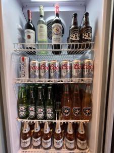 a refrigerator filled with lots of bottles of beer at Best Western Shadow Inn in Woodland