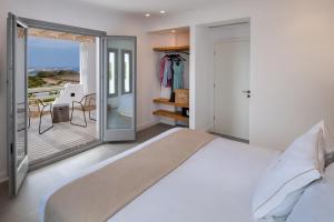 Postel nebo postele na pokoji v ubytování La Ponta Villas & Suites + 37 fotografií