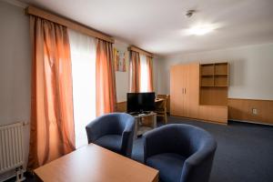 Uma televisão e/ou sistema de entretenimento em Hotel Clavis