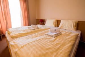 Uma cama ou camas num quarto em Hotel Clavis