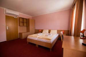 Uma cama ou camas num quarto em Hotel Clavis