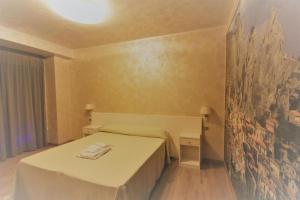 Letto o letti in una camera di I Rocchi Hotel