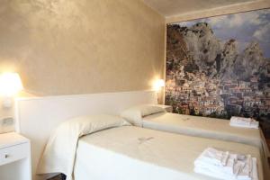 Letto o letti in una camera di I Rocchi Hotel