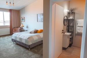 Rúm í herbergi á Hotel Kaldi