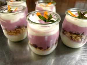 a group of four mason jars filled with desserts at Liftstüberl Hintersee in Hintersee