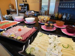 a buffet with many different types of food on a counter at Zentral Hotel in Bad Füssing