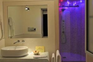 a bathroom with a sink and a shower at I Rocchi Hotel in Tito