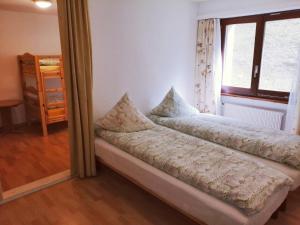 Voodi või voodid majutusasutuse Hotel Gemmi toas