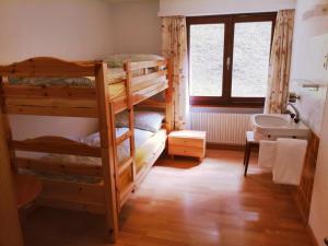 Voodi või voodid majutusasutuse Hotel Gemmi toas