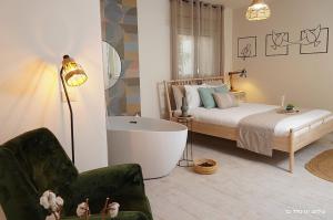 Ένα ή περισσότερα κρεβάτια σε δωμάτιο στο Anise Suites