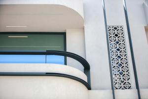 a window on the side of a building at Souda Plaza Collection in Souda