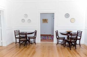 a dining room with a table and chairs at Patinha Inn in Évora