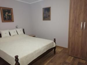 Postel nebo postele na pokoji v ubytování Apartman Sandrina