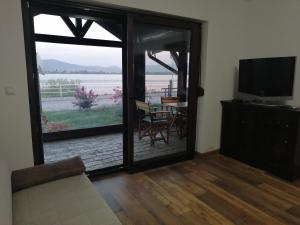 TV a/nebo společenská místnost v ubytování Apartman Sandrina + 4 fotografie