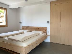 Postel nebo postele na pokoji v ubytování Bregenzerwaldblick
