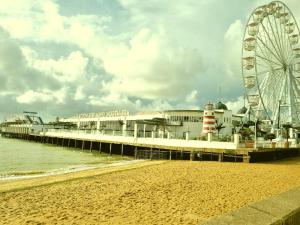 a pier with a ferris wheel on the beach at OYO Pier Hotel in Clacton-on-Sea