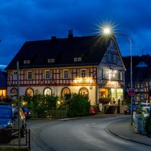 a building with a street light in front of it at Suite Appartements Da Giovanni in Gladenbach