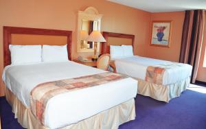 Ένα ή περισσότερα κρεβάτια σε δωμάτιο στο Laughlin River Lodge