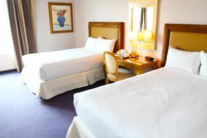 Ένα ή περισσότερα κρεβάτια σε δωμάτιο στο Laughlin River Lodge