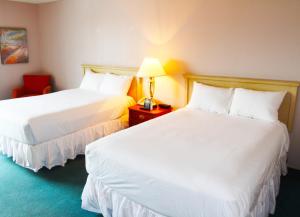 Ένα ή περισσότερα κρεβάτια σε δωμάτιο στο Laughlin River Lodge