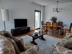 a living room with a couch and a table at Azores Essence - Paim in Ponta Delgada