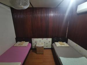 Katil atau katil-katil dalam bilik di AnNur Homestay