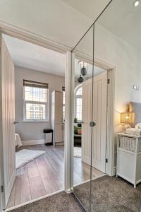 a room with a glass door leading to a bedroom at Guest Homes - Bennett Apartment in Worcester