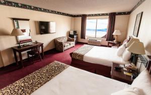 a hotel room with two beds and a desk at Hoover Dam Lodge in Boulder City +19 photos