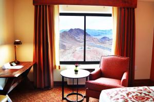 a hotel room with a chair and a window at Hoover Dam Lodge in Boulder City